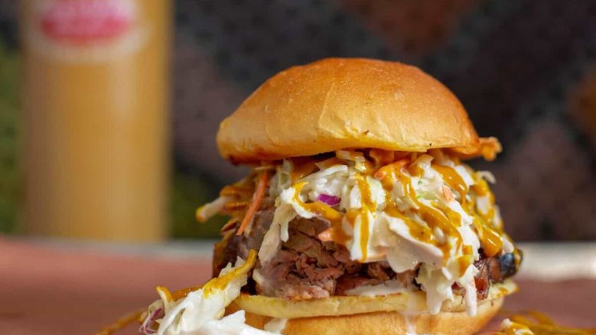 Sugarfire Smoke House signature dishes Brisket Sandwich/Plate, Ribs, Pulled Pork Sandwich/Plate, Brisket Cheesesteak.